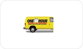 A yellow van with the words " one hour heating & air conditioning ".