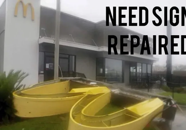 A yellow banana peel in front of a mcdonalds.